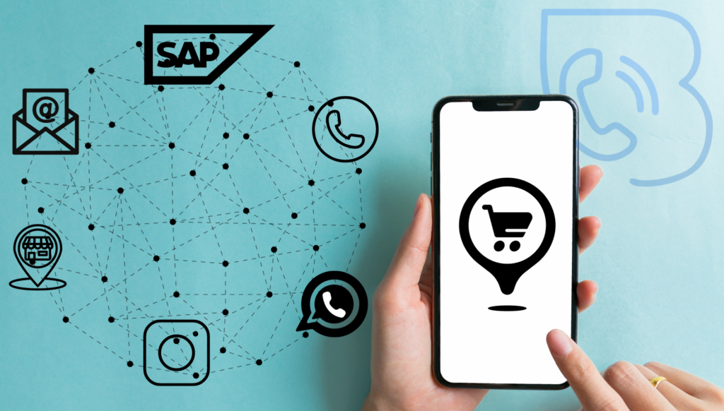 Uma pessoa usando um celular representando um momento de compra, ao lado de uma teia de softwares utilizados pela massa: SAP, whatsapp, e-mail, instagram. Significando a integração entre eles.